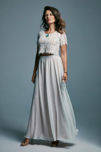 A delicate wedding dress with a light smooth skirt and a lace top Porto 23
