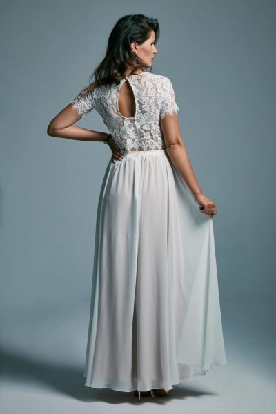 A delicate wedding dress with a light smooth skirt and a lace top Porto 23