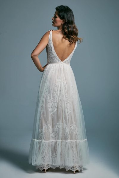 A light, airy wedding dress with a deep cut at the back Porto 15