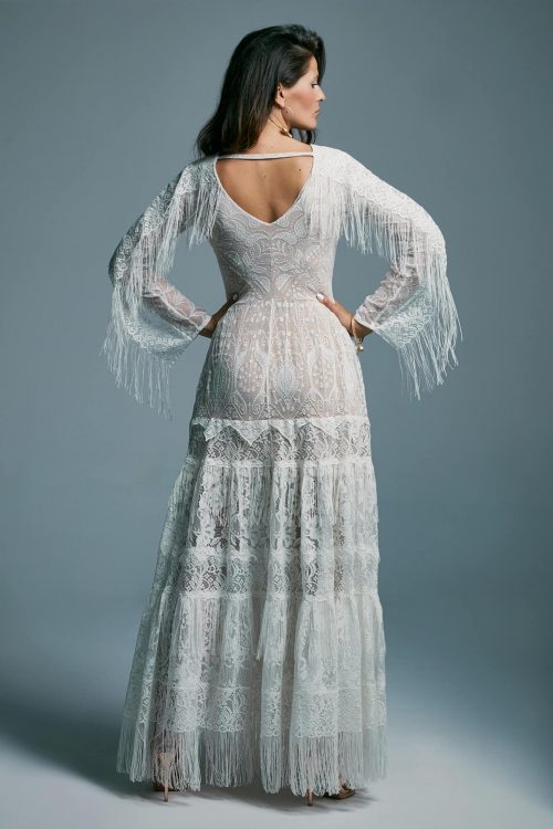 A wedding dress with a long, decorated sleeves and a fringed skirt Porto 7